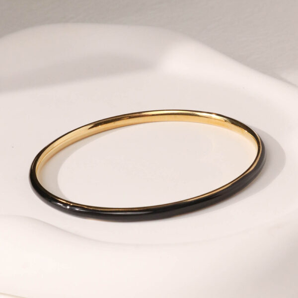 Chris April in stock minimalist 316L stainless steel PVD gold plated enamel black colored bangle bracelet - Image 4